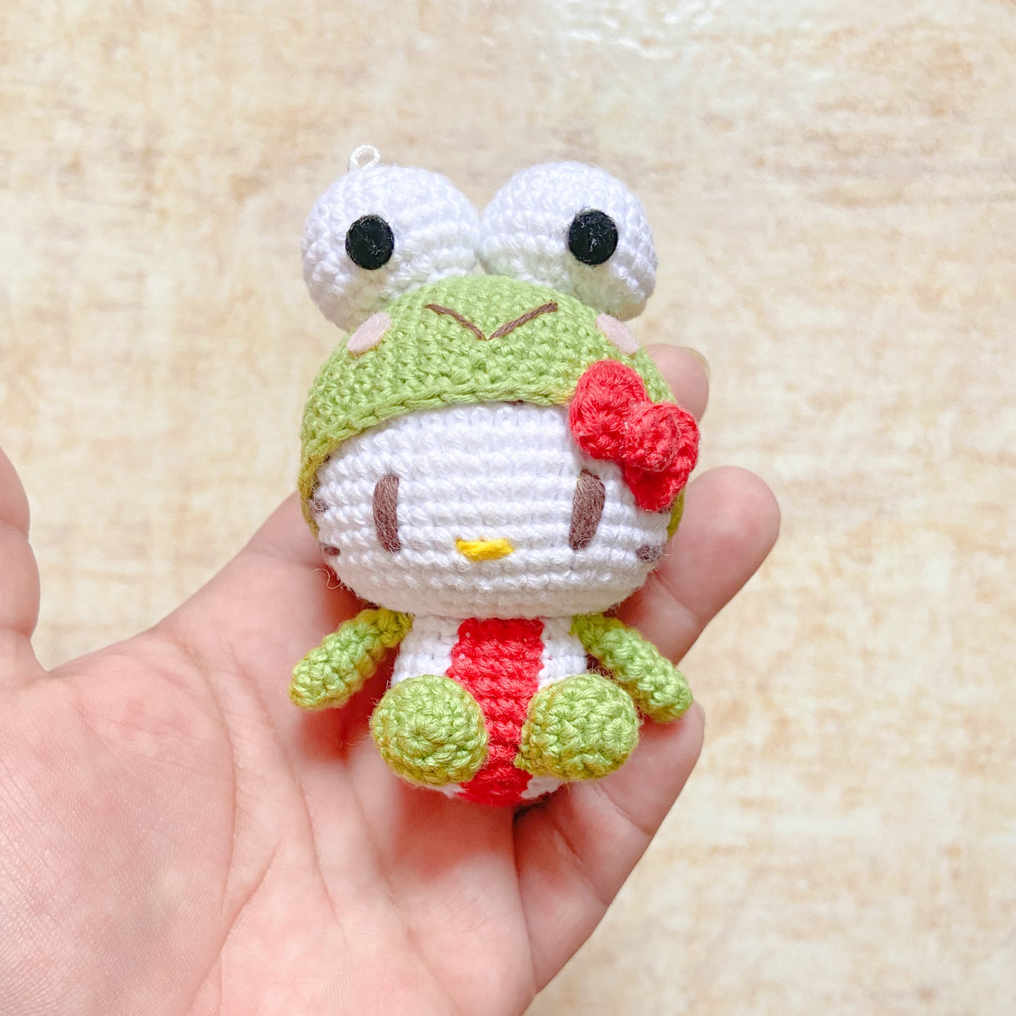 Hello Kitty in Keroppi Suit