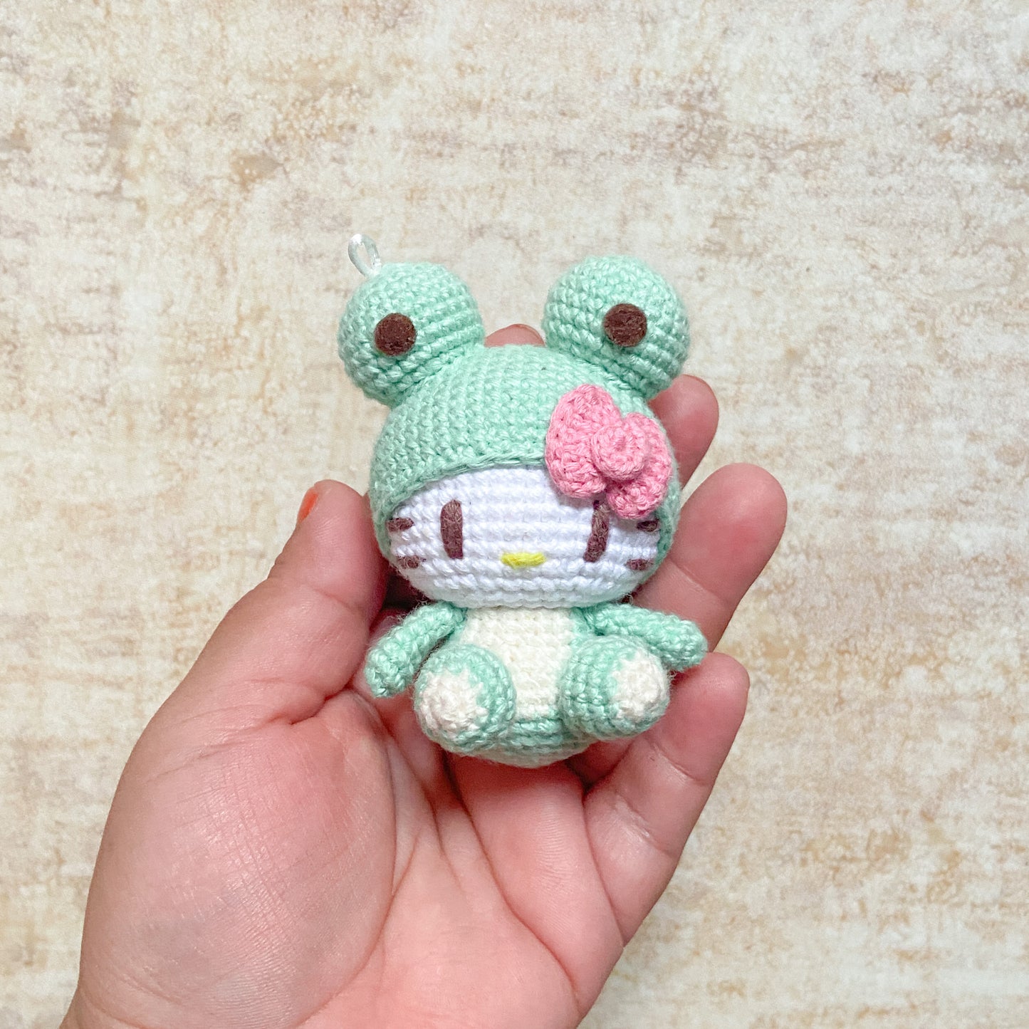 Hello Kitty in Frog Suit